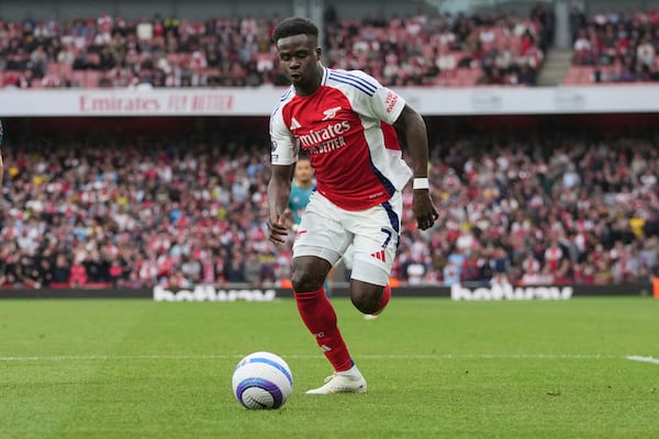 Arsenal's Bukayo Saka controls the ball during the English Premier League soccer match between Arsenal and Bournemouth at Emirates stadium in London, Saturday, May 3, 2025. (AP Photo/Kin Cheung)