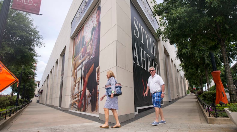 05/15/2018 -- Atlanta, GA -- Pedestrians walk through The Shops Buckhead Atlanta located in Atlanta's Buckhead community, Tuesday, May 15, 2018. In the four years since the Shops Buckhead Atlanta transitioned from a hole in the ground to a high-end shopping destination, it has struggled to find its footing ALYSSA POINTER/ATLANTA JOURNAL-CONSTITUTION