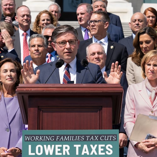 Speaker of the House Mike Johnson, R-La., and fellow Republicans celebrate GOP tax policies at an event outside the Capitol in Washington, Wednesday, April 15, 2026. (AP Photo/J. Scott Applewhite)
