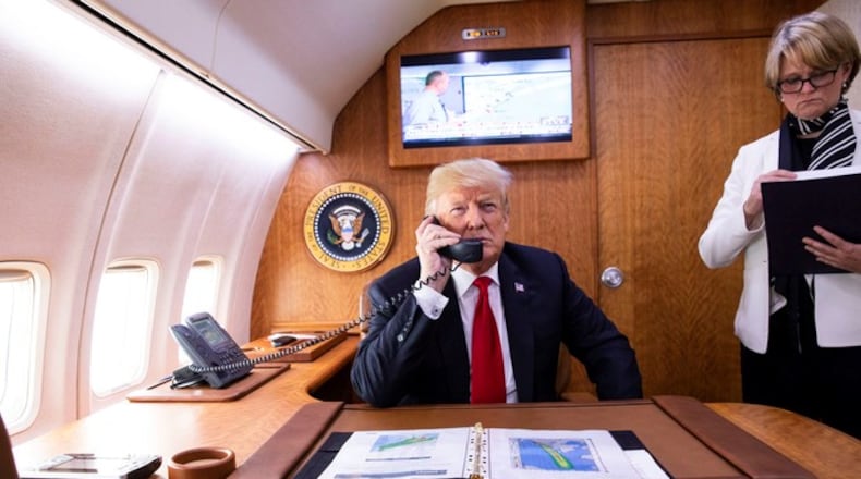 President Donald Trump, joined by National Security Council Deputy Chief of Staff Joan O’Hara,  talks to Gov. Nathan Deal about Hurricane Michael aboard Air Force One on Oct. 10, 2018. (Official White House Photo by Joyce N. Boghosian)