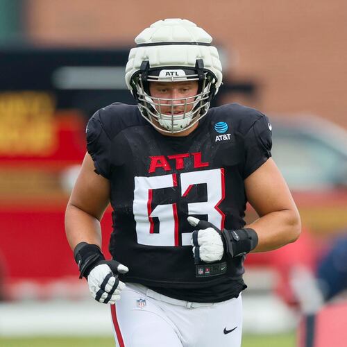 Falcons guard and eight-year veteran Chris Lindstrom, shown here during a joint practice with the Titans in August, says he felt like a rookie under new offensive line coach Bill Callahan. “I definitely felt like a baby deer for a minute there,” Lindstrom said last month. (Miguel Martinez/AJC 2025)