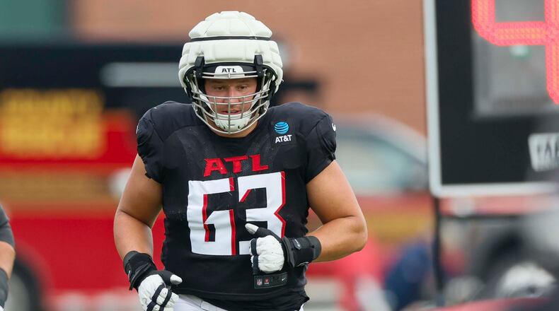 Falcons guard and eight-year veteran Chris Lindstrom, shown here during a joint practice with the Titans in August, says he felt like a rookie under new offensive line coach Bill Callahan. “I definitely felt like a baby deer for a minute there,” Lindstrom said last month. (Miguel Martinez/AJC 2025)