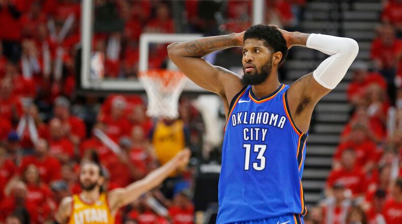 Oklahoma City Thunder forward Paul George (13) holds his head after a teammate fouls a Jazz player in the second half during Game 3 of an NBA basketball first-round playoff series Saturday, April 21, 2018, in Salt Lake City. The Jazz won 115-102.