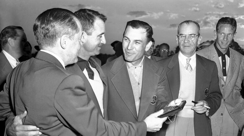 FILE - Ben Hogan, third from left, of Fort Worth, Texas, receives his plaque for winning the Masters golf tournament from Bobby Jones, left, in Augusta, Ga. on April 8, 1951. Others are: Skee Riegel, runner up; Cliff Roberts, tournament chairman; and Charles Coe, low amateur. (AP Photo/Horace Cort, File)