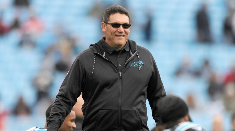 Carolina Panthers head coach Ron Rivera watches his team warm up before an NFL football game against the Atlanta Falcons in Charlotte, N.C., Saturday, Dec. 24, 2016. (AP Photo/Mike McCarn)