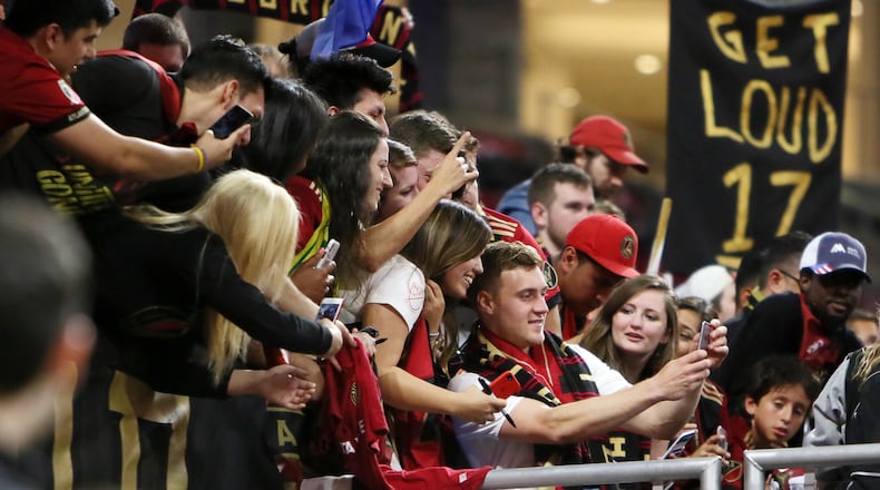 Atlanta United midfielder Julian Gressel takes selfies with fans, he was name best player of the match after scoring a goal and one assistance against LAFC April 7, 2018, at Mercedes-Benz Stadium in Atlanta.