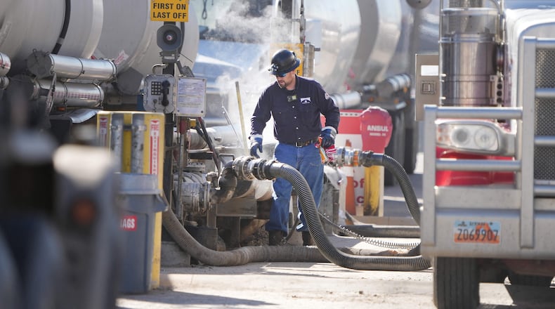 Gasoline comes to drivers at the end of a long supply chain that starts with oil being pumped from the earth, moved to refineries that turn oil into gas and then send it around the country. Key to pump prices is the price of oil. Here, oil tank trucks drop off the crude to be refined into gas at the Marathon Oil Refinery in Salt Lake City, Utah. (George Frey/AFP/Getty Images/TNS)