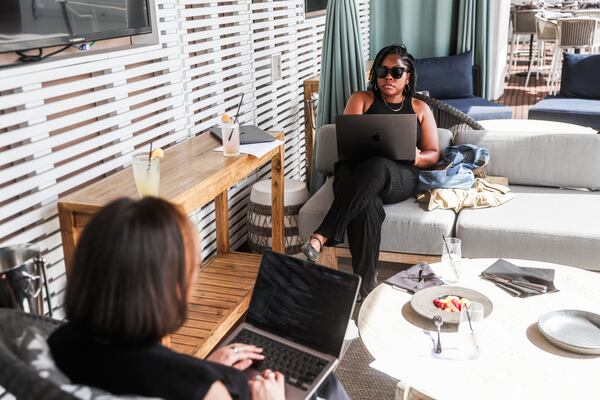 Kimber Warren, founder of glassware line Sela K, has a brainstorming meeting at Retreat by the Gathering Spot in Atlanta on Friday, March 6, 2026. (Abbey Cutrer/AJC)