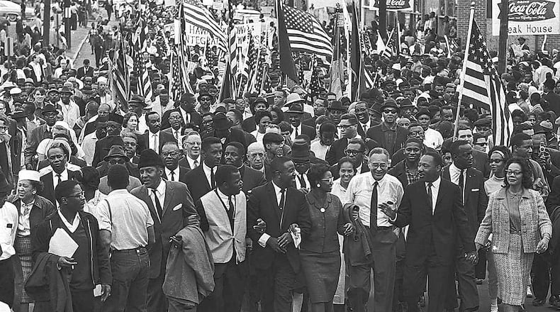 Dr. Martin Luther King Jr. and wife Coretta Scott King (right) were among those at the head of the 1965 voting rights march from Selma, Ala., to Montgomery. Weeks earlier, marchers were routed by police at the Edmund Pettus Bridge. This march, the third attempt, drew over 8,000 people.