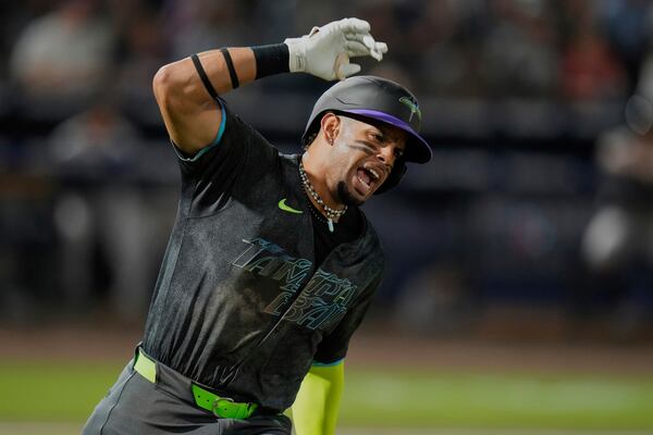 Tampa Bay Rays' Christopher Morel celebrates his solo home run off Atlanta Braves pitcher Bryce Elder during the sixth inning of a baseball game Friday, April 11, 2025, in Tampa, Fla. (AP Photo/Chris O'Meara)