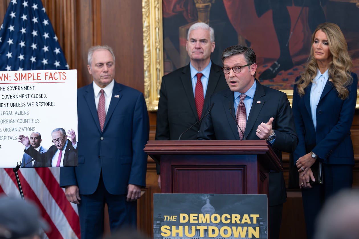 Speaker of the House Mike Johnson, R-La., faces reporters, joined from left by Majority Leader Steve Scalise, R-La. (left), Majority Whip Tom Emmer, R-Minn. (center), and Small Business Administration head Kelly Loeffler (right) at a news conference on day 27 of the government shutdown, at the Capitol in Washington, Monday, Oct. 27, 2025. (J. Scott Applewhite/AP)