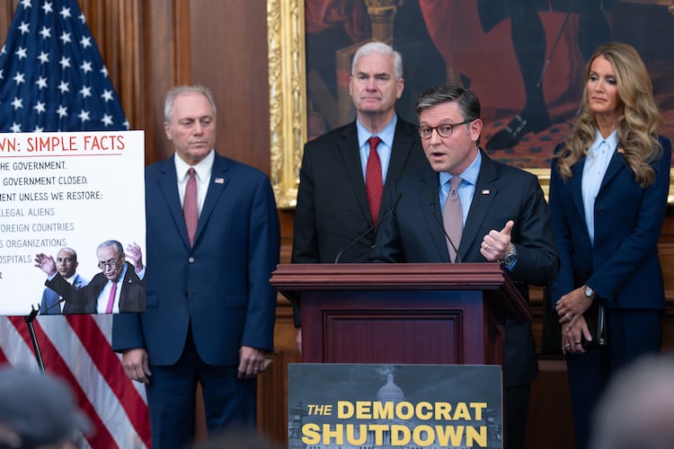 Speaker of the House Mike Johnson, R-La., faces reporters, joined from left by Majority Leader Steve Scalise, R-La. (left), Majority Whip Tom Emmer, R-Minn. (center), and Small Business Administration head Kelly Loeffler (right) at a news conference on day 27 of the government shutdown, at the Capitol in Washington, Monday, Oct. 27, 2025. (J. Scott Applewhite/AP)