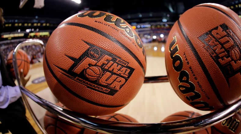 In this April 3, 2015, file photo, basketballs sit in a rack during Michigan State practice at the Final Four in Indianapolis. (AP Photo/David J. Phillip, File)