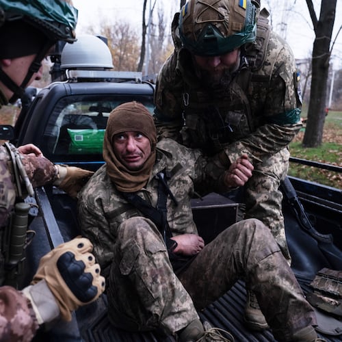 In this photo provided by Ukraine's 93rd Kholodnyi Yar Separate Mechanized Brigade press service, servicemen evacuate their wounded fellow soldier Oleg Solonchak near Kostyantynivka, Donetsk region, Ukraine, Tuesday, Nov. 11, 2025. (Iryna Rybakova/Ukraine's 93rd Mechanized Brigade via AP)