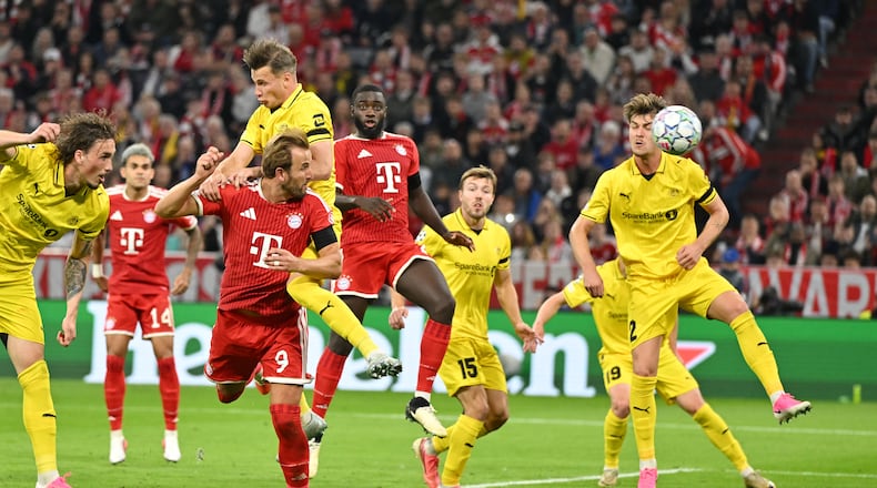 Bayern's Harry Kane, third from left bottom, scores his side's second goal during the Champions League opening phase soccer match between Bayern Munich and Bodo Glimt in Munich, Germany, Thursday, Sept. 10, 2026. (AP Photo/Lennart Preiss)