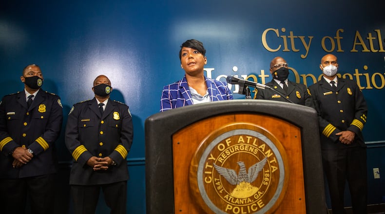 After the approval vote of the Public Safety Training Center this week, Mayor Mayor Keisha Lance Bottoms, Atlanta Police Chief Rodney Bryant, Chief Rod Smith of the Atlanta Fire Rescue Department and Dave Wilkinson of the Atlanta Police Foundation address questions about the facility, it's location and the concerns of the community Thursday, Sept 9, 2021. (Jenni Girtman for The Atlanta Journal-Constitution)