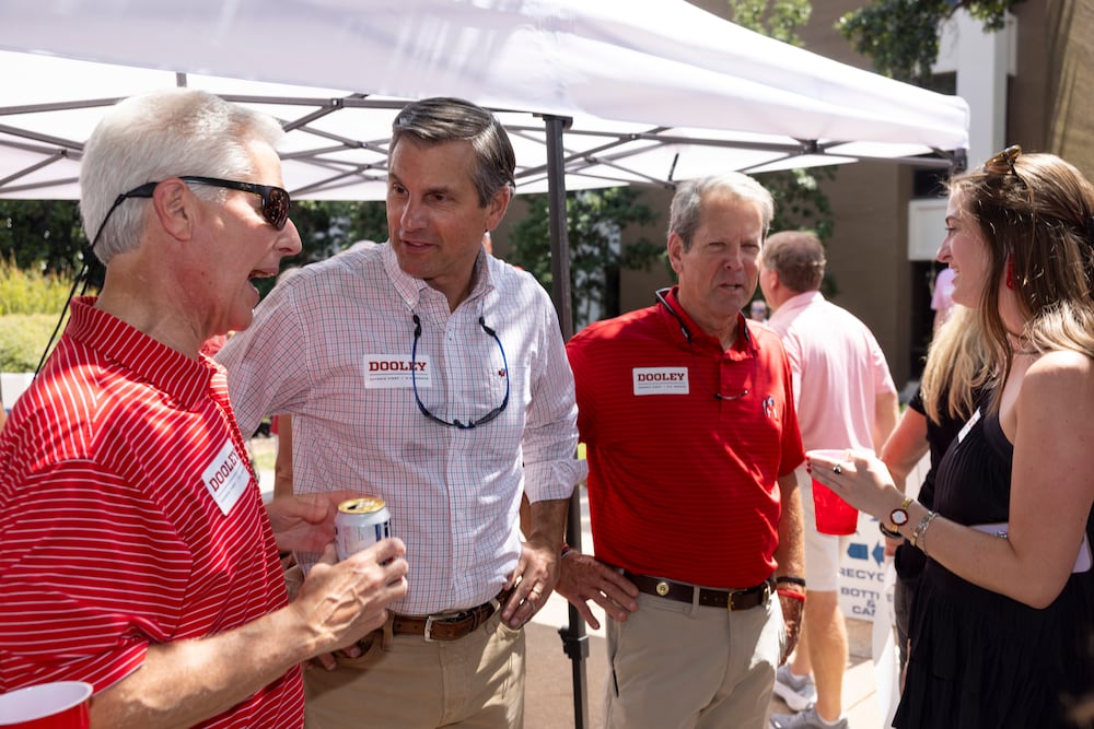 Gov. Brian Kemp (second from right) campaigned with Republican U.S. Senate candidate Derek Dooley (second from left) in Athens on Saturday.