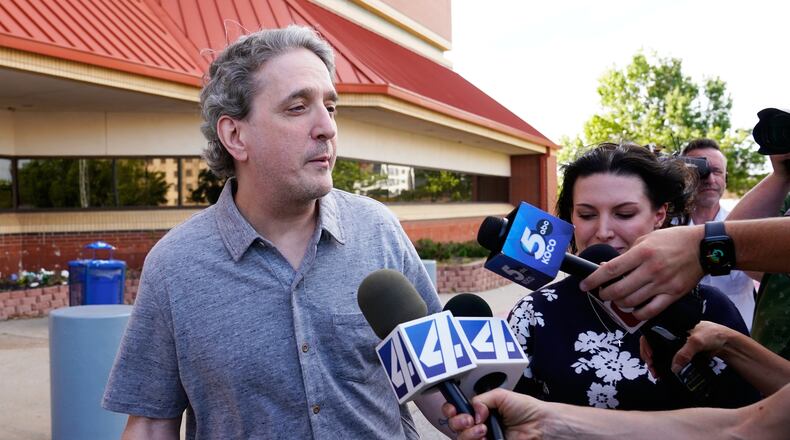 FILE - Former death row prisoner Richard Glossip, left, speaks to media after exiting a detention facility after being granted bond while awaiting retrial, May 14, 2026, in Oklahoma City. (AP Photo/Nick Oxford, File)