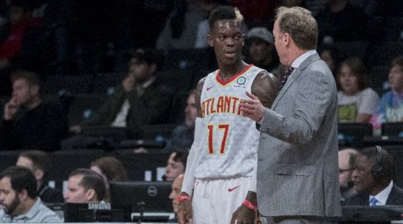 Hawks guard Dennis Schroder and coach Mike Budenholzer during happier times. (AP Photo)