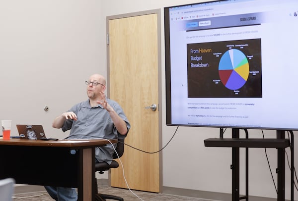 Marty Lang, the director of the University of Georgia's MFA program in film, television and digital media, talks to students during his crowdfunding class at Athena Studios in Athens on Monday, April 7, 2025. (Natrice Miller/AJC)