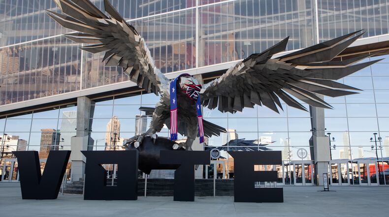 The Atlanta Falcon decorated for the Georgia runoff election at Mercedes Benz Stadium on Monday, December 21, 2020, in Atlanta. Fulton County and Mercedes Benz stadium have teamed up to provide a COVID-19 safe voting location for the upcoming senatorial runoff election. CHRISTINA MATACOTTA FOR THE ATLANTA JOURNAL-CONSTITUTION