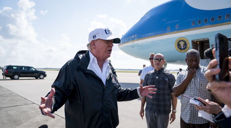 President Donald Trump talks to reporters as he arrives in Ft. Myers, Fla., Sept. 14, 2017. Trump on Friday used an unfolding terrorist attack in London to revive his push for a travel ban for people from predominantly Muslim countries, an effort that has been hampered by U.S. courts. The proposed restrictions have faced legal challenges and drawn criticism because of concerns that they amount to discrimination based on religion. (Doug Mills/The New York Times)