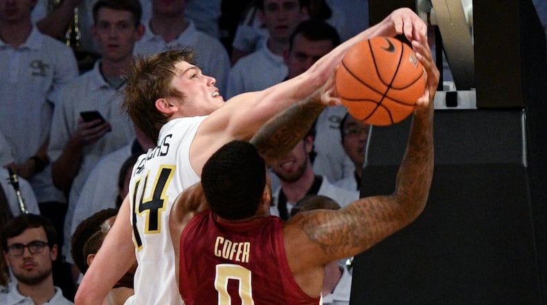 Georgia Tech center Ben Lammers gets his hand on the shot of Florida State forward Phil Cofer during the second half of an NCAA basketball game Wednesday, Jan. 25, 2017, in Atlanta. Georgia Tech won 78-56. (AP Photo/John Amis)