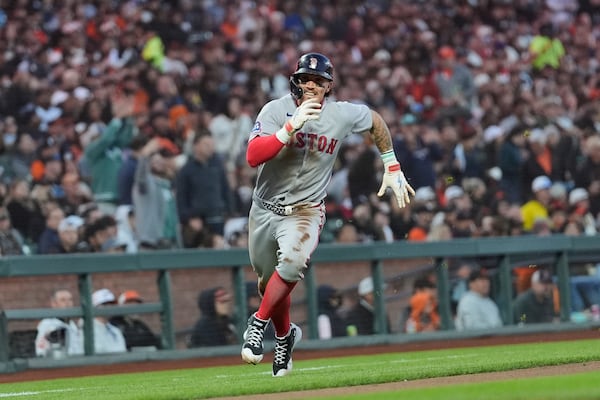 Boston Red Sox's Jarren Duran runs home to score against the San Francisco Giants during the fifth inning of a baseball game in San Francisco, Friday, June 20, 2025. (AP Photo/Jeff Chiu)