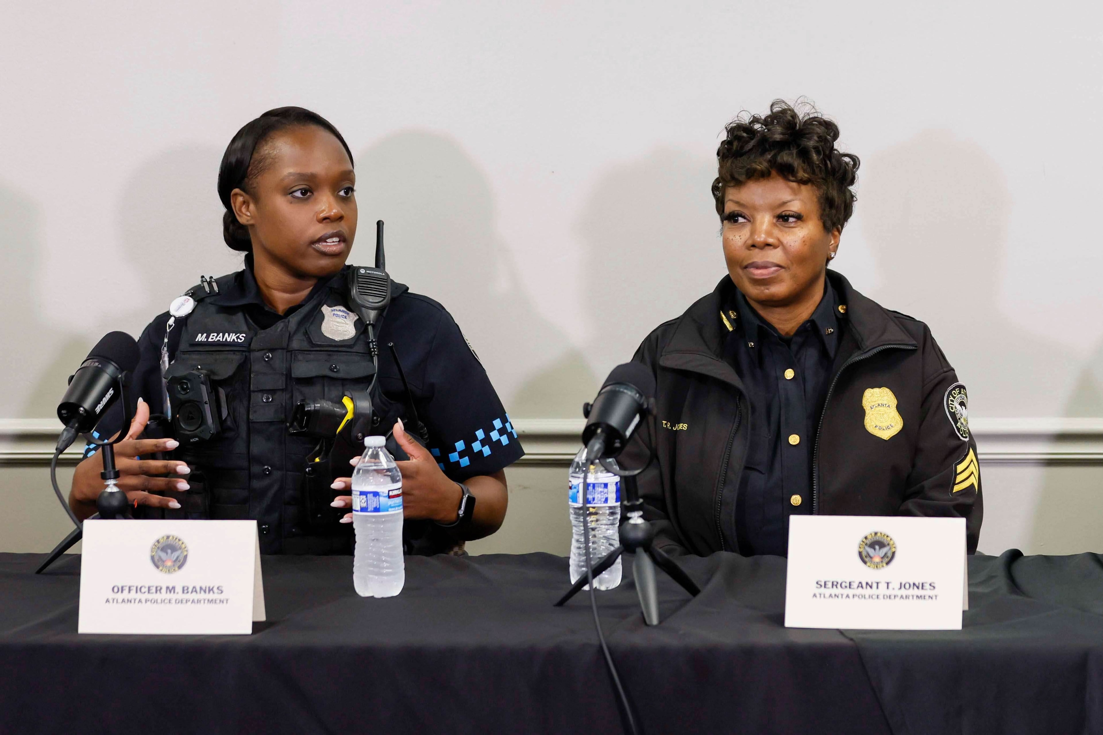 Police officer Myesha Banks (left) and Sgt. Tywana Jones talk about Monday's incident at the airport. (Miguel Martinez/Atlanta Journal-Constitution)