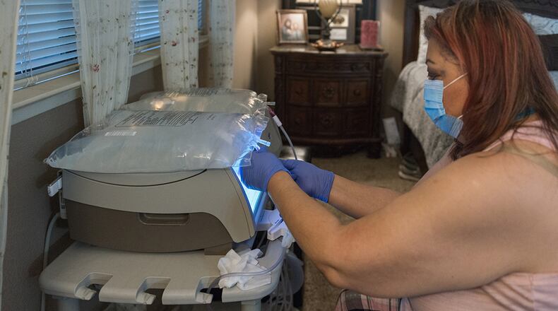 Maria Duenas, 60, has kidney failure and is on the kidney transplant list. But until she finds a match, she will administer her own dialysis treatment at home. (Heidi de Marco/Kaiser Health News/TNS)