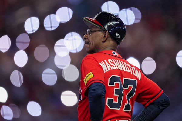 A 2023 file photo shows then-Atlanta Braves third base coach Ron Washington looking on during a pitching change.