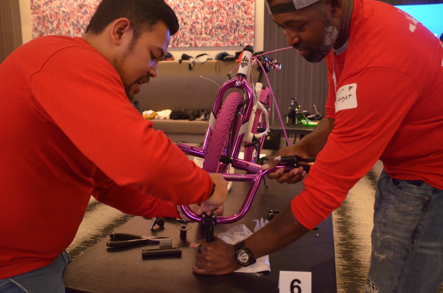 Delta volunteers assemble 100 bicycles to donate to kids