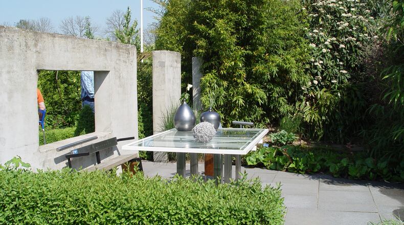 A concrete wall and dense planting create a winter sun catcher suitable for dining and work as well. (Handout/TNS)