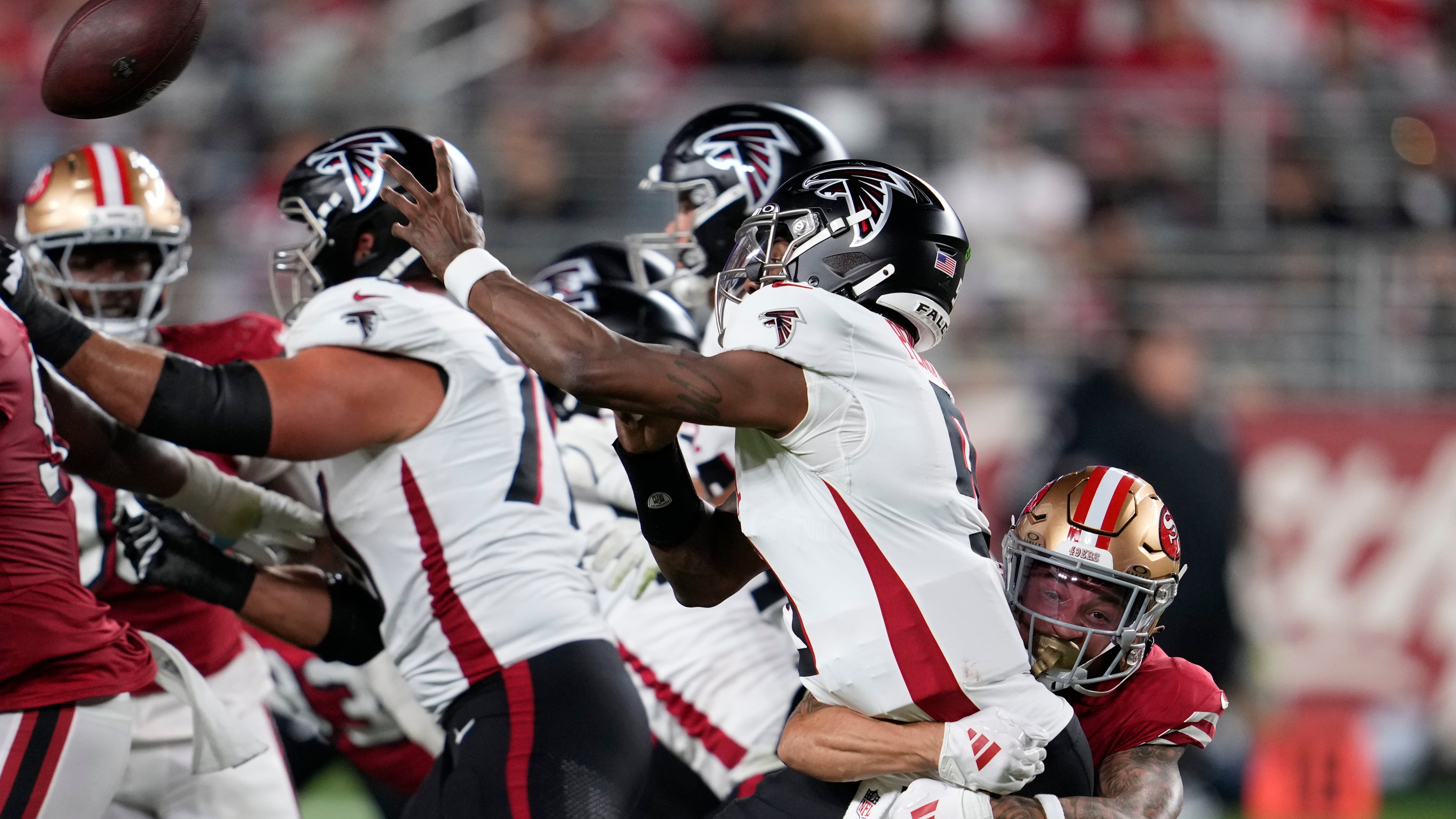 Atlanta Falcons quarterback Michael Penix Jr. has a bone bruise and might miss Sunday's game against the Dolphins, which would result in backup Kirk Cousins starting his place. (Godofredo A. Vásquez/AP)