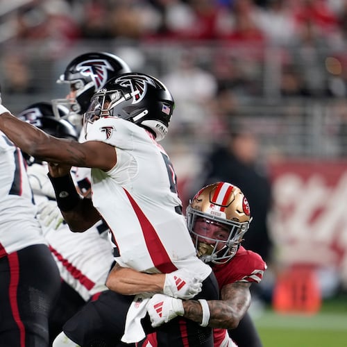 Atlanta Falcons quarterback Michael Penix Jr. has a bone bruise and might miss Sunday's game against the Dolphins, which would result in backup Kirk Cousins starting his place. (Godofredo A. Vásquez/AP)