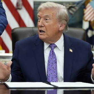 President Donald Trump gestures during a signing ceremony on an AI initiative in the Oval Office of the White House, Thursday, Dec. 11, 2025, in Washington. (AP Photo/Alex Brandon)