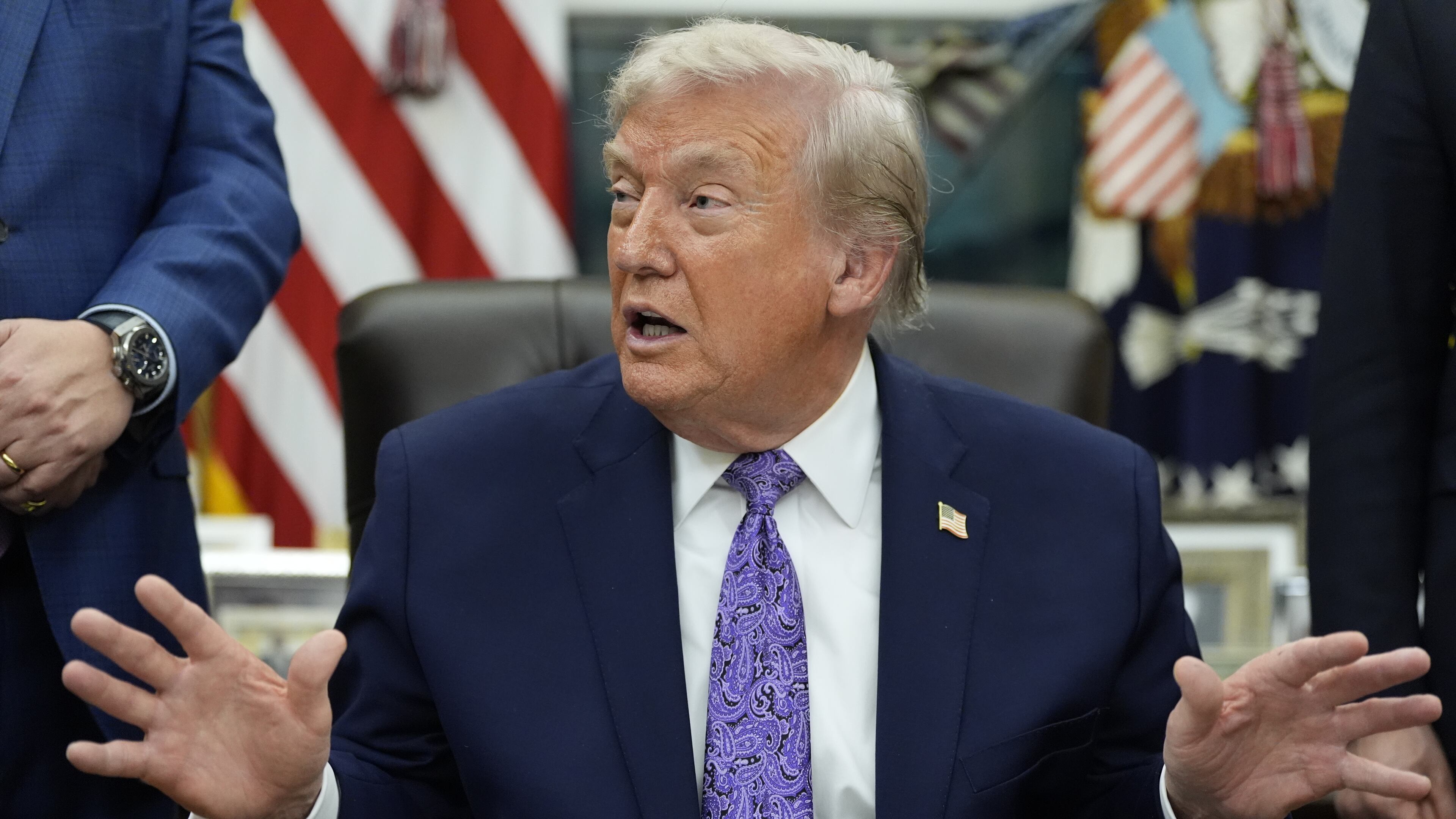 President Donald Trump gestures during a signing ceremony on an AI initiative in the Oval Office of the White House, Thursday, Dec. 11, 2025, in Washington. (AP Photo/Alex Brandon)