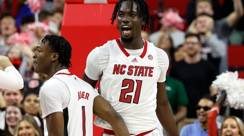 North Carolina State's Ebenezer Dowuona (21) celebrates a basket against Duke during the first half of an NCAA college basketball game in Raleigh, N.C., Wednesday, Jan. 4, 2023. (AP Photo/Karl B DeBlaker)