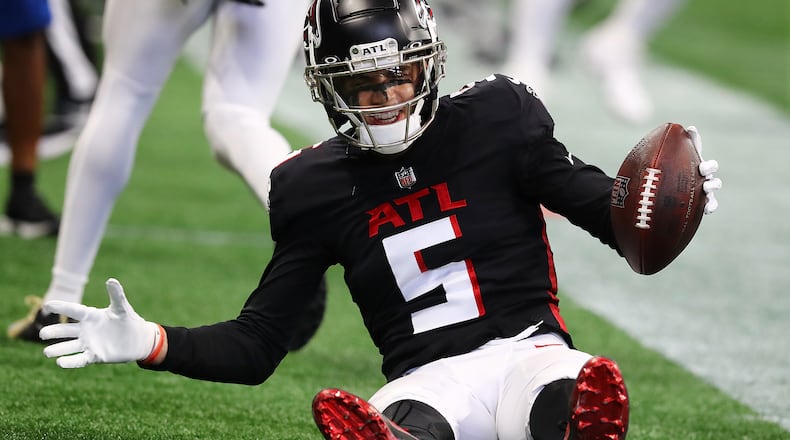 Rookie wide receiver Drake London, the Falcons' top draft pick, reacts as he is knocked out of bounds after catching a pass against the New Orleans Saints during the first half in a NFL football game on Sunday, Sept. 11, 2022, in Atlanta.   “Curtis Compton / Curtis Compton@ajc.com