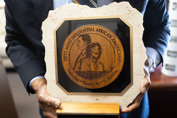 State Sen. Ed Harbison, D-Columbus, holds an award honoring the “50 Most Influential African Americans” in the Columbus area in his office at the Capitol in Atlanta on May 14, 2026. (Arvin Temkar/AJC)