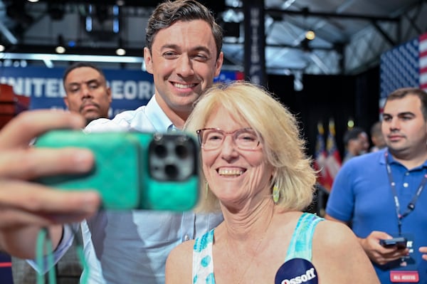 U.S. Sen. Jon Ossoff takes a selfie with an attendee at a campaign event on Saturday, June 27, 2026, in Savannah. (Sarah Peacock for the AJC)