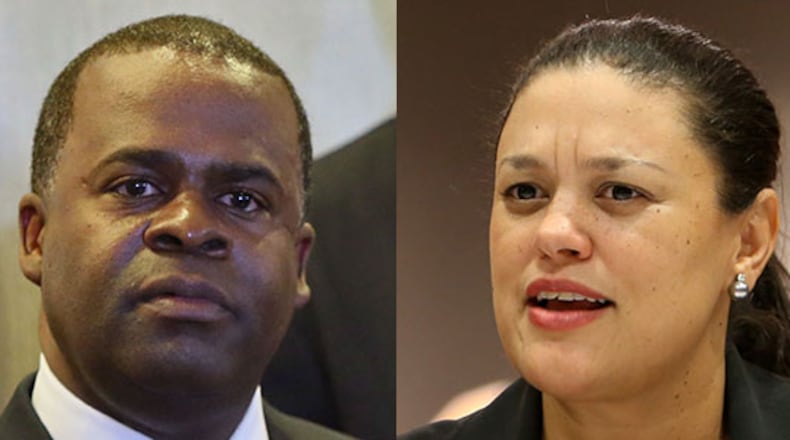 Mayor Kasim Reed (left) and Atlanta Public Schools Superintendent Meria Carstarphen are locked in a dispute over deeds the city holds to APS property.