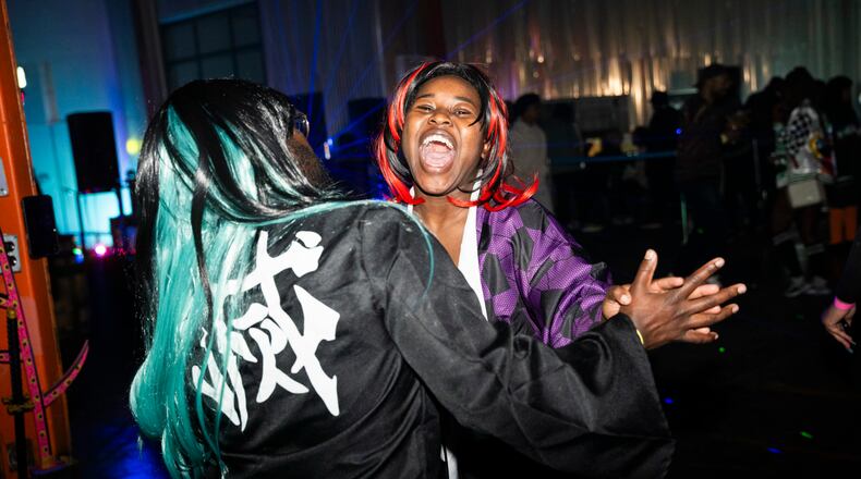 Party guests enjoy the high energy environment at Cxmmunity Media's partnership with local event brand, Trap Sushi, at Monday Night Garage in Atlanta Georgia, on Friday, Feb. 23, 2024. (Olivia Bowdoin for the AJC).