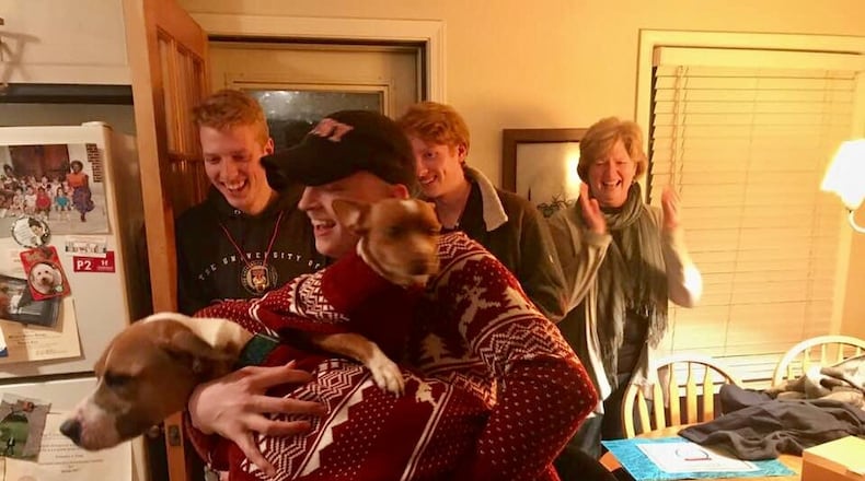 After eight months of chemo and two surgeries, Michael was released from care and hopefully cured as he came home for Christmas 2017. He was happy to see his dapper dogs. (Photo by Phil Huelson)