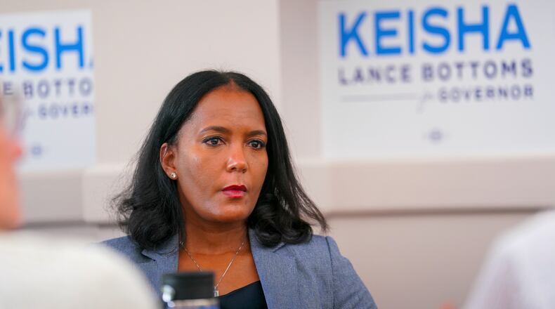 Georgia Democratic gubernatorial candidate and former Atlanta Mayor Keisha Lance Bottoms listens to laid off Centers for Disease Control and Prevention (CDC) workers during a roundtable in Clarkston, Ga., at the the start of her campaign tour, Thursday, July 24, 2025. (Matthew Pearson/WABE via AP)