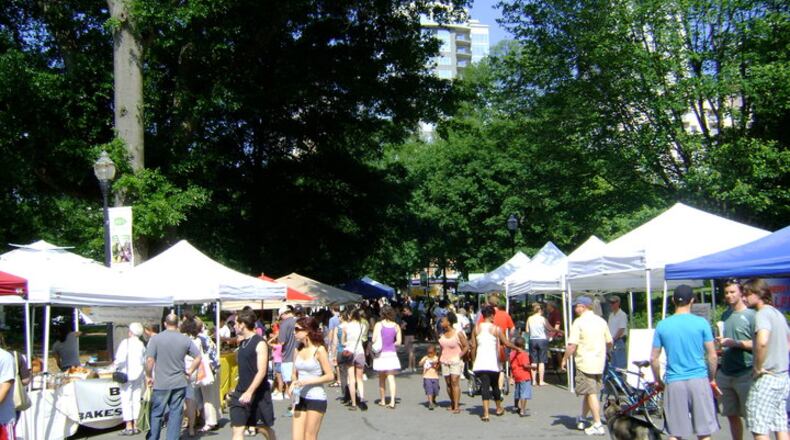 Crowds gather to buy fresh produce and meats at the Green Market. SPECIAL