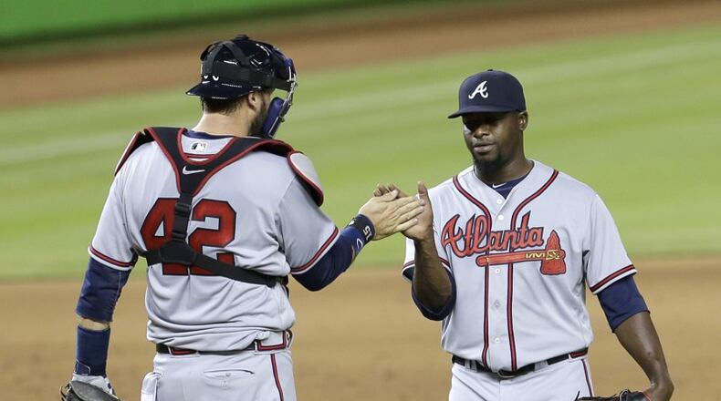 Arodys Vizcaino receives congratulations from catcher Tyler Flowers after recording a four-out save in the Braves’ first win of the 2016 season. (AP photo)