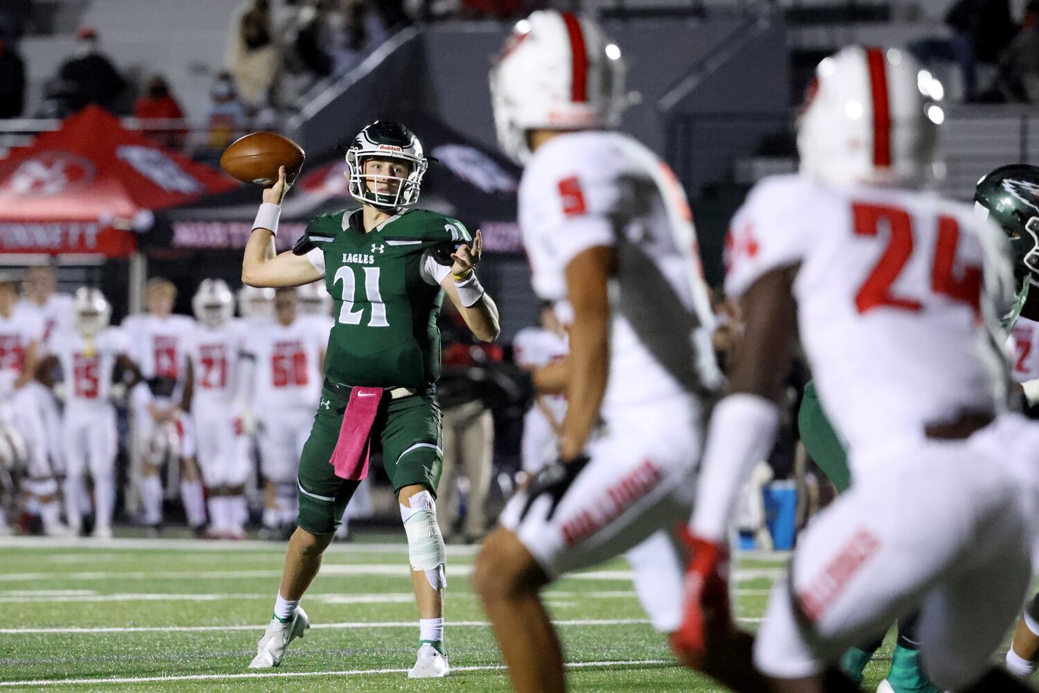 Collins Hill quarterback Sam Horn (21) throws a touchdown pass in the first half against North Gwinnett. JASON GETZ FOR THE ATLANTA JOURNAL-CONSTITUTION