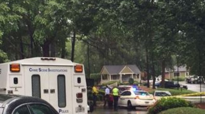 Gwinnett County police investigate after a woman was shot and killed at a Peachtree Corners apartment complex on Friday, July 3, 2015. (Channel 2 Action News)