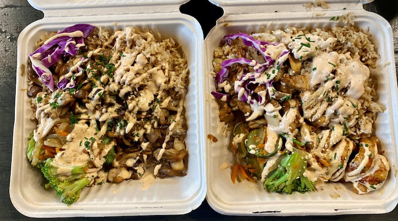 At Hippie Hibachi Vegan Grill, the mains (including tofu and mushrooms) are served with a heaping amount of fried rice, plus sautéed veggies, squiggles of house-made yum yum sauce and a sprinkle of chives and sesame seeds. Wendell Brock for The Atlanta Journal-Constitution